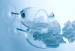 ice cubes in a glass on a reflective surface