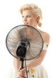housewife with fan playing pop star