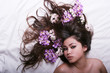 Photo: pretty woman with flowers on her hair pretty woman with flowers on her hair