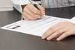 Foto: woman writting contract woman writting contract