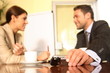 business man and woman talking in the office