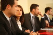 group of business persons at a conference, man in