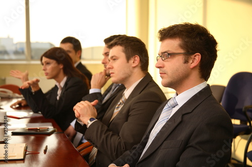 five professional people at the formal meeting.