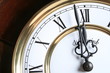 old clock close-up with roman numbers