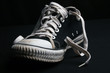 black shoe with white laces