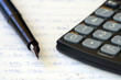 fountain pen with calculator and mathematics
