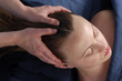 massaging head and scalp at wellness center