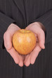 business woman eve holding an apple