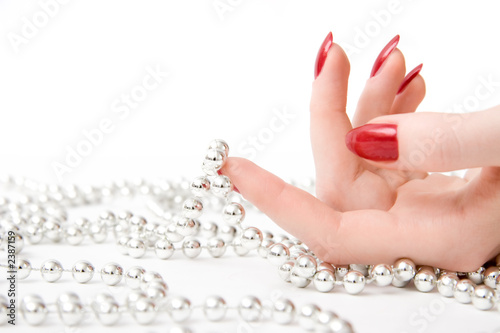 woman hand with beads woman hand with beads