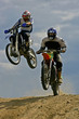 jumping motorcyclists