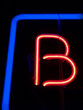 "letters": neon red "b" with blue frame