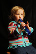 toddler with blue flute