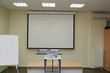 Foto: projection screen in the boardroom with projector projection screen in the boardroom with projector