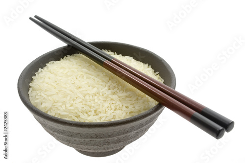 Photo: bowl of rice with chopsticks bowl of rice with chopsticks