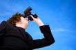 business vision - businesswoman over a blue sky