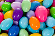 close - up of a basket full of multicolored easter eggs