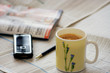 coffee, newspaper and mobile
