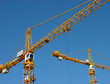 Photo en ligne au meilleur prix two cranes at work