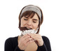 young woman eating chocolate