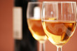 two wine glasses and a bottle a wine