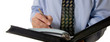 business man writing in leather organizer
