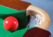 Photo: a red snooker ball balanced at a corner pocket a red snooker ball balanced at a corner pocket