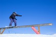 snowboarder doing a boardslide