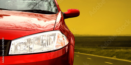 Photo: red sport car on a highway red sport car on a highway