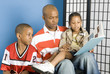 father reading to his children