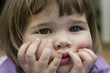 Photo: cute little girl holding face cute little girl holding face
