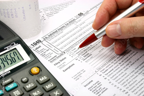 Photo: filling out tax form filling out tax form
