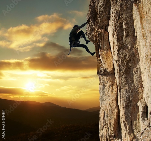 Fototapeta climber on sunset