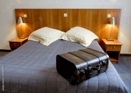 hotel room with suitcase