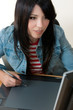 girl working on a graphic tablet girl working on a graphic tablet