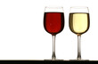 glasses of white and red wine on table