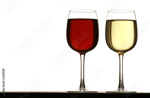 glasses of white and red wine on table