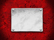 steel plate on a red grunge background