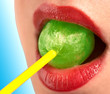 the girl with red lips sucks a green sweet
