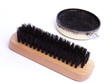 brush and black shoe polish