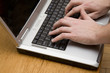 hands typing on laptop computer hands typing on laptop computer