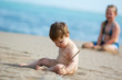 boy plays on beach