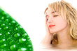 Photo: relaxed woman and green leaf with waterdrops relaxed woman and green leaf with waterdrops