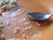 orange plate and metal spoon