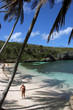 woman in a deserted paradisiac beach