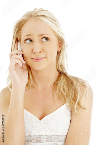 Photo: surprised teenage girl with a phone surprised teenage girl with a phone