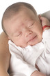 baby sleeping on mother´s arms. studio shot. baby sleeping on mother´s arms. studio shot.
