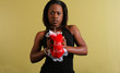 african american woman squeezing love pillow