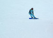 a girl riding down on the snowboard