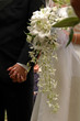wedding ceremony  bride's flowers holding hands