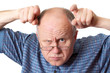 bald senior man fooling around. bald senior man fooling around.